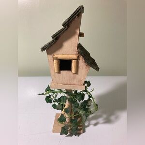 Rustic Wooden Birdhouse with Greenery